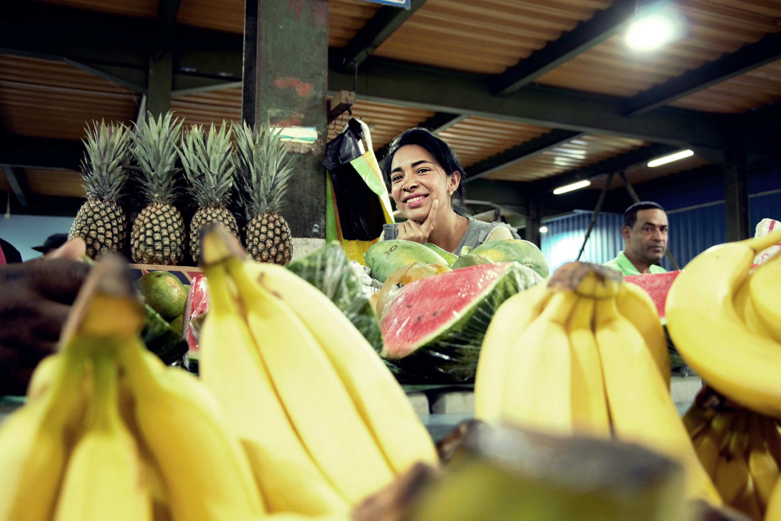 Traveler buying organic produce at a local farmers market