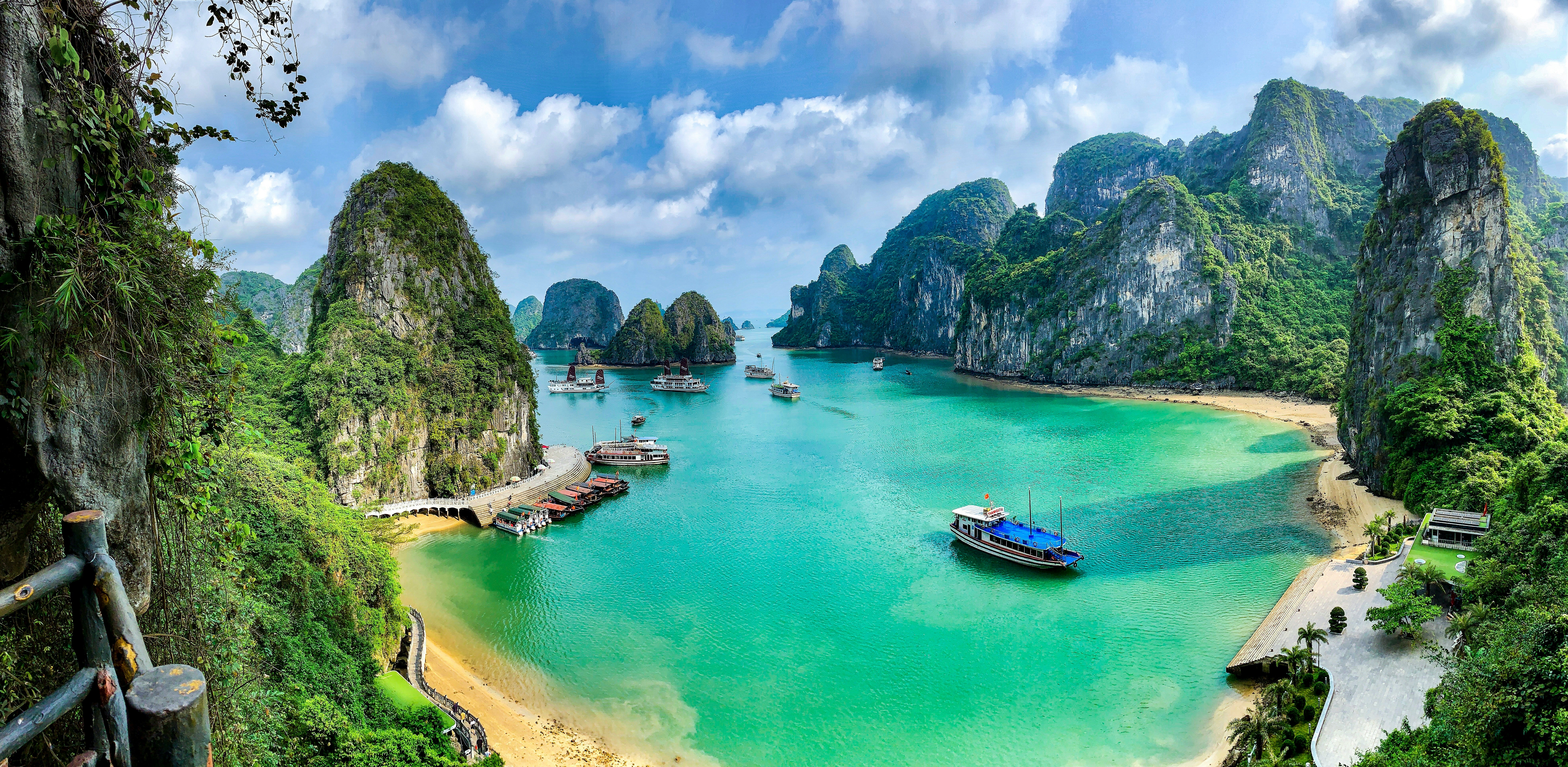 Solo female backpacker looking over the limestone karsts of Ha Long Bay, Vietnam