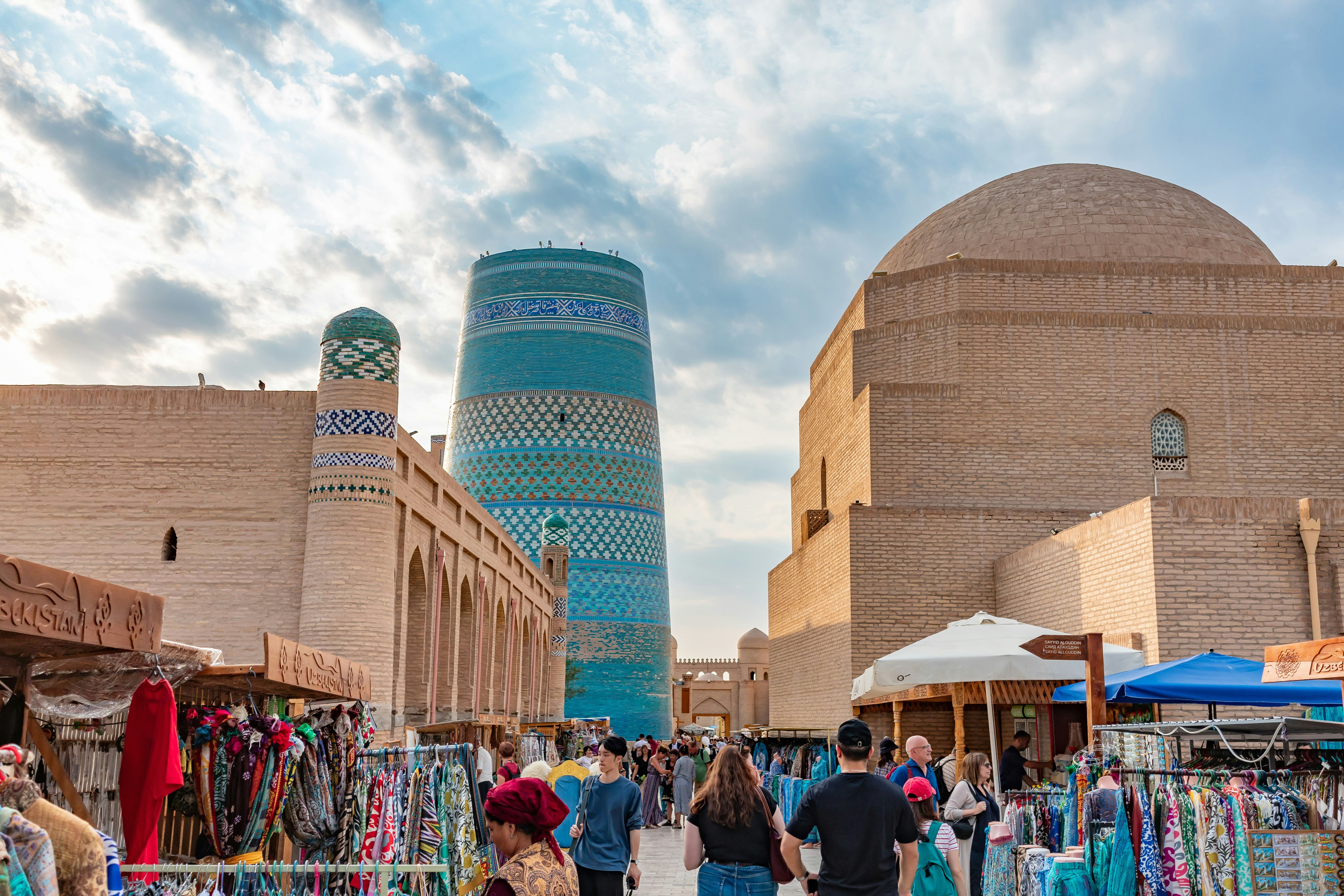Turquoise tilework glowing in early morning sunlight in Khiva