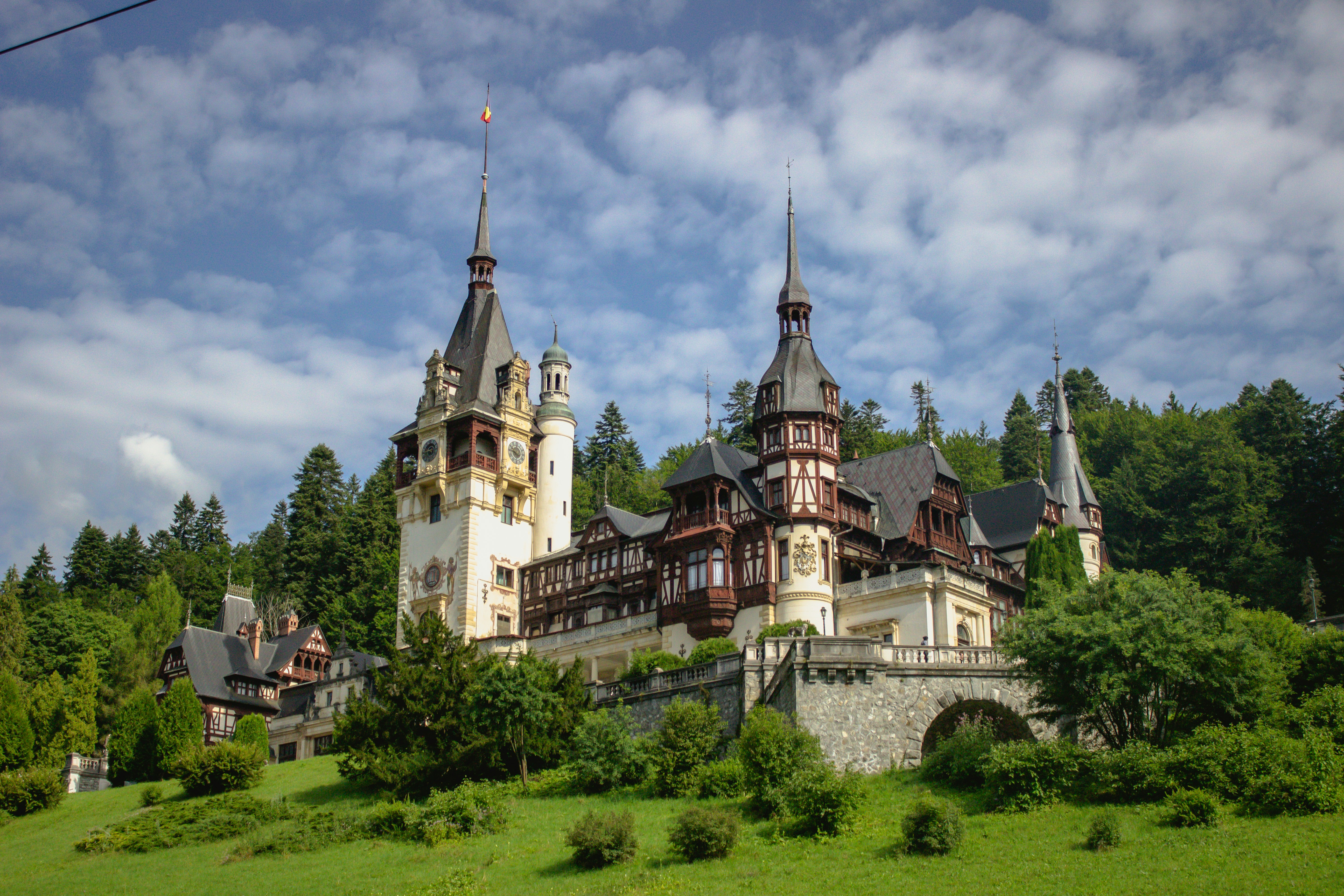 Bran Castle in Transylvania, Romania, surrounded by misty hills