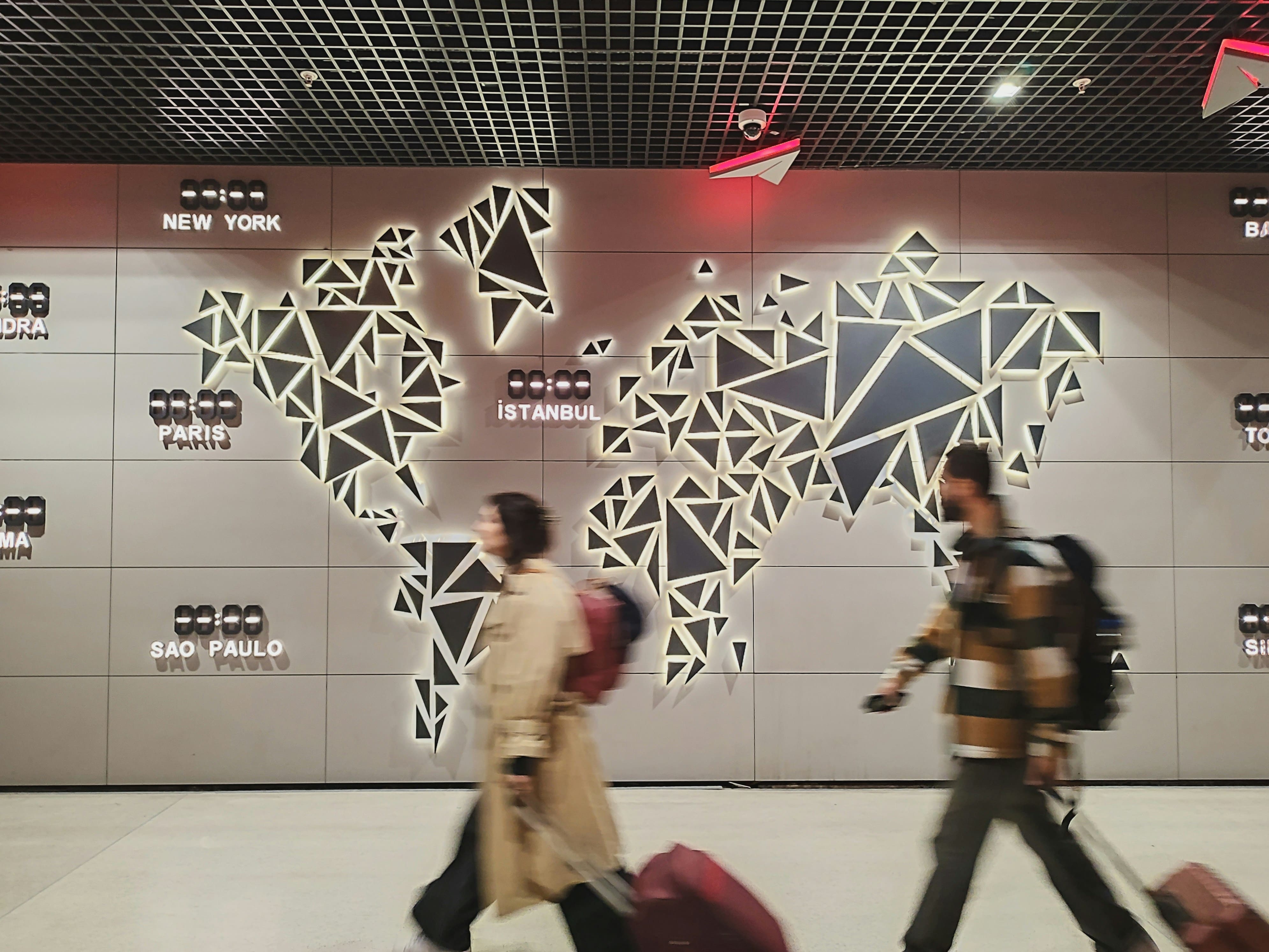 Person analyzing patterns on a world map with travel markers